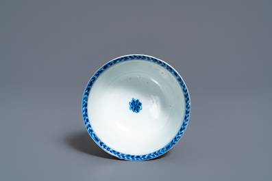 A Chinese blue and white 'mother with child' cup and saucer, Kangxi