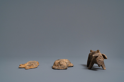 A Chinese earthenware model of a stable and five animals, Han
