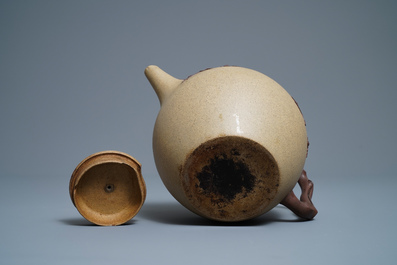 A large Chinese Yixing stoneware teapot with applied prunus design, Kangxi