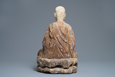 A large Chinese painted wood figure of a Buddhist monk, Ming