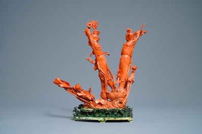 A large Chinese carved red coral group of two ladies with fans, 19th C.