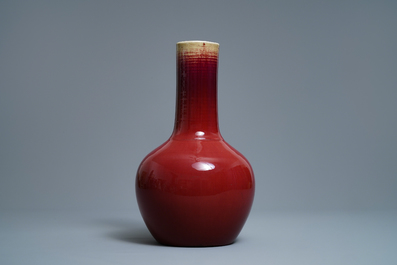 A Chinese monochrome sang-de-boeuf bottle vase, 19th C.