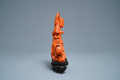 A Chinese carved red coral group of Guanyin on an elephant, 19th C.