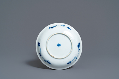 A Chinese blue and white 'mother with child' cup and saucer, Kangxi