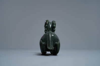 A Chinese spinach green jade model of a recumbent ram, 19/20th C.