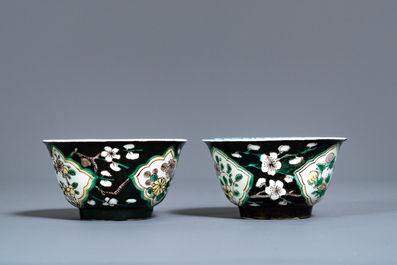 A pair of rare Chinese famille noire cups and saucers, Kangxi