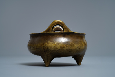 A Chinese bronze tripod censer, Xuande mark, 18/19th C.