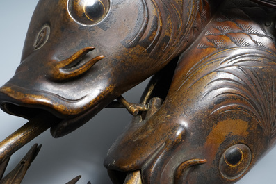 A Japanese bronze group depicting two koi fish, Meiji, 19th C.