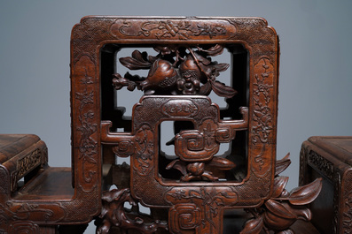 A Chinese finely carved wooden display stand, 19th C.