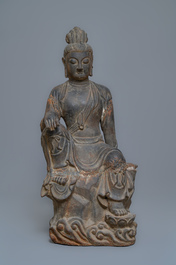 A large Chinese cast iron figure of Guanyin with inscription on the back, Ming/Qing
