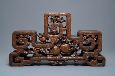 A Chinese finely carved wooden display stand, 19th C.