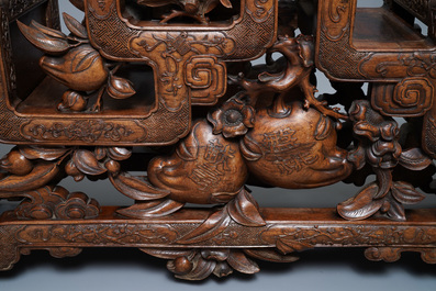 A Chinese finely carved wooden display stand, 19th C.