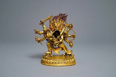 A Sino-Tibetan gilt bronze group of Mahakala and his consort Yab-Yum, 19th C.