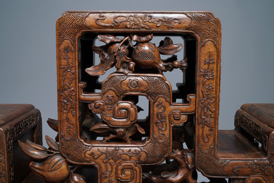 A Chinese finely carved wooden display stand, 19th C.