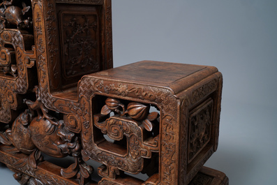 A Chinese finely carved wooden display stand, 19th C.