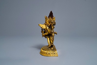 A Sino-Tibetan gilt bronze group of Mahakala and his consort Yab-Yum, 19th C.