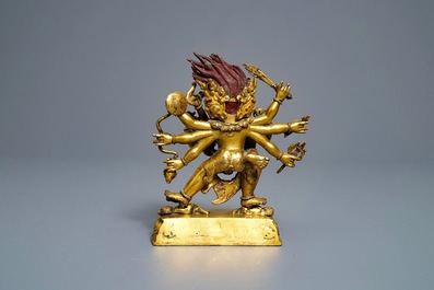 A Sino-Tibetan gilt bronze group of Mahakala and his consort Yab-Yum, 19th C.