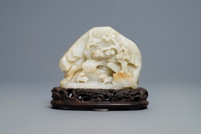 A Chinese celadon jade 'mountain landscape' boulder, 19/20th C.