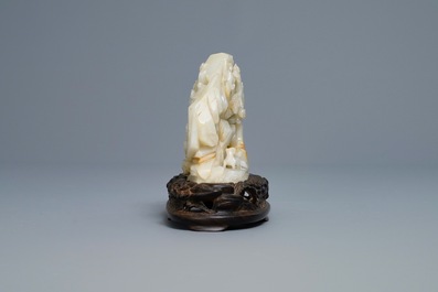 A Chinese celadon jade 'mountain landscape' boulder, 19/20th C.