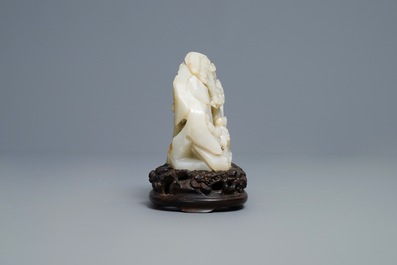 A Chinese celadon jade 'mountain landscape' boulder, 19/20th C.