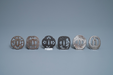 Twenty-five various Japanese bronze and metal tsuba, Meiji, 19th C.