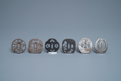 Twenty-five various Japanese bronze and metal tsuba, Meiji, 19th C.