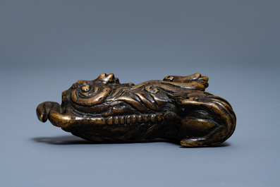 A Chinese bronze 'mythical beast' scroll weight, Ming