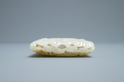 A Chinese reticulated pale celadon jade 'dragon and phoenix' carving, Ming