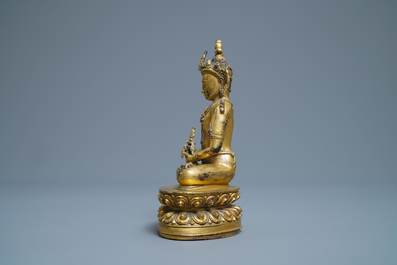 A Chinese coral- and turquoise-inlaid gilt bronze figure of Buddha Amitayus, 18/19th C.
