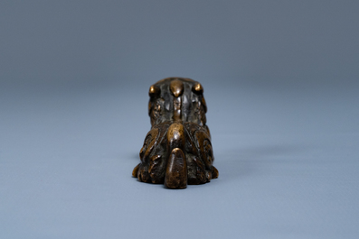 A Chinese bronze 'mythical beast' scroll weight, Ming