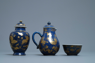 A Chinese gilt-decorated powder blue cream jug, a tea caddy and a tea bowl with roosters, Yongzheng