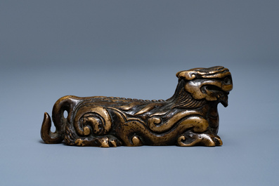 A Chinese bronze 'mythical beast' scroll weight, Ming