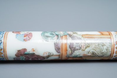 A Chinese famille rose opium pipe with silk pouch, 19th C.