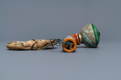 A Chinese famille rose opium pipe with silk pouch, 19th C.