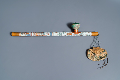 A Chinese famille rose opium pipe with silk pouch, 19th C.