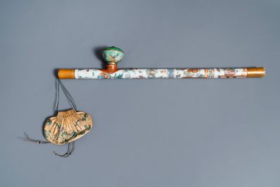 A Chinese famille rose opium pipe with silk pouch, 19th C.