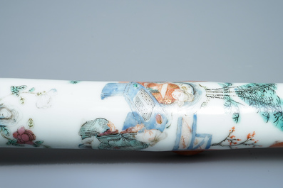 A Chinese famille rose opium pipe with silk pouch, 19th C.