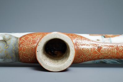 A Chinese famille rose opium pipe with silk pouch, 19th C.