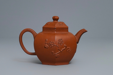 A Chinese Yixing stoneware teapot and cover with applied prunus design, Kangxi