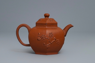 Een Chinese Yixing steengoed theepot met prunus in reli&euml;f, Kangxi