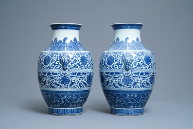 A pair of Chinese blue and white hu vases with floral scrolls, Qianlong mark, 19th C.