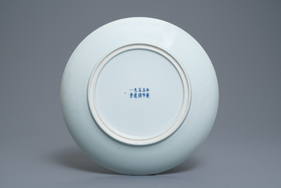 A Chinese blue and white 'peony scroll' dish, marked 'Made in Jingdezhen in 1955'
