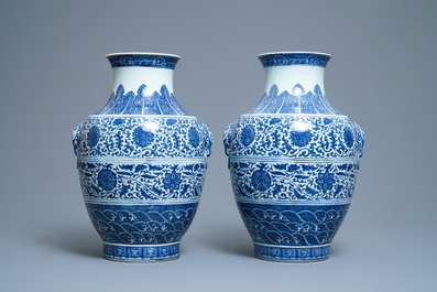 A pair of Chinese blue and white hu vases with floral scrolls, Qianlong mark, 19th C.