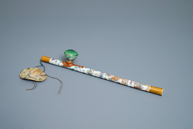 A Chinese famille rose opium pipe with silk pouch, 19th C.