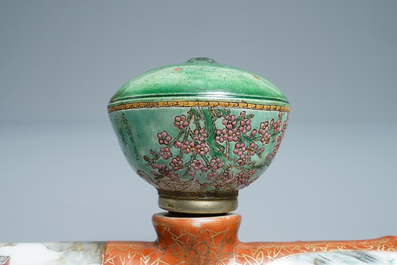 A Chinese famille rose opium pipe with silk pouch, 19th C.