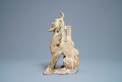 A Chinese straw-glazed stoneware 'earth spirit', Sui (581-617)