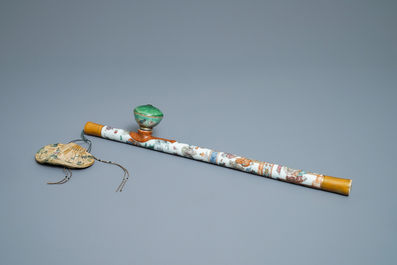 A Chinese famille rose opium pipe with silk pouch, 19th C.