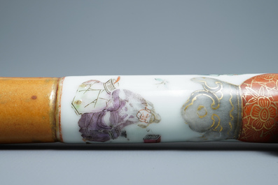 A Chinese famille rose opium pipe with silk pouch, 19th C.