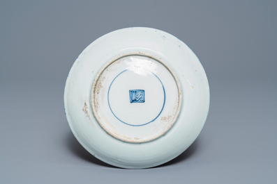 A rare Chinese reverse-decorated 'magpie and prunus' plate, Transitional period