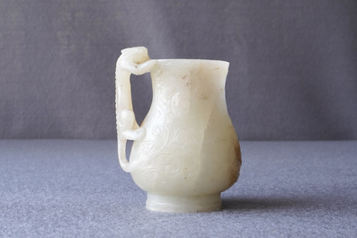 A Chinese celadon russet jade chilong-handled jug, Qing